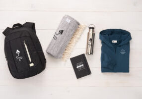 Branded backpack, blanket drinkware and outerwear gift