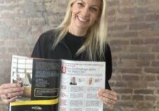 Sarah Whitaker, owner of Williams Advertising, holding up a magazine showing the article that she is featured in.